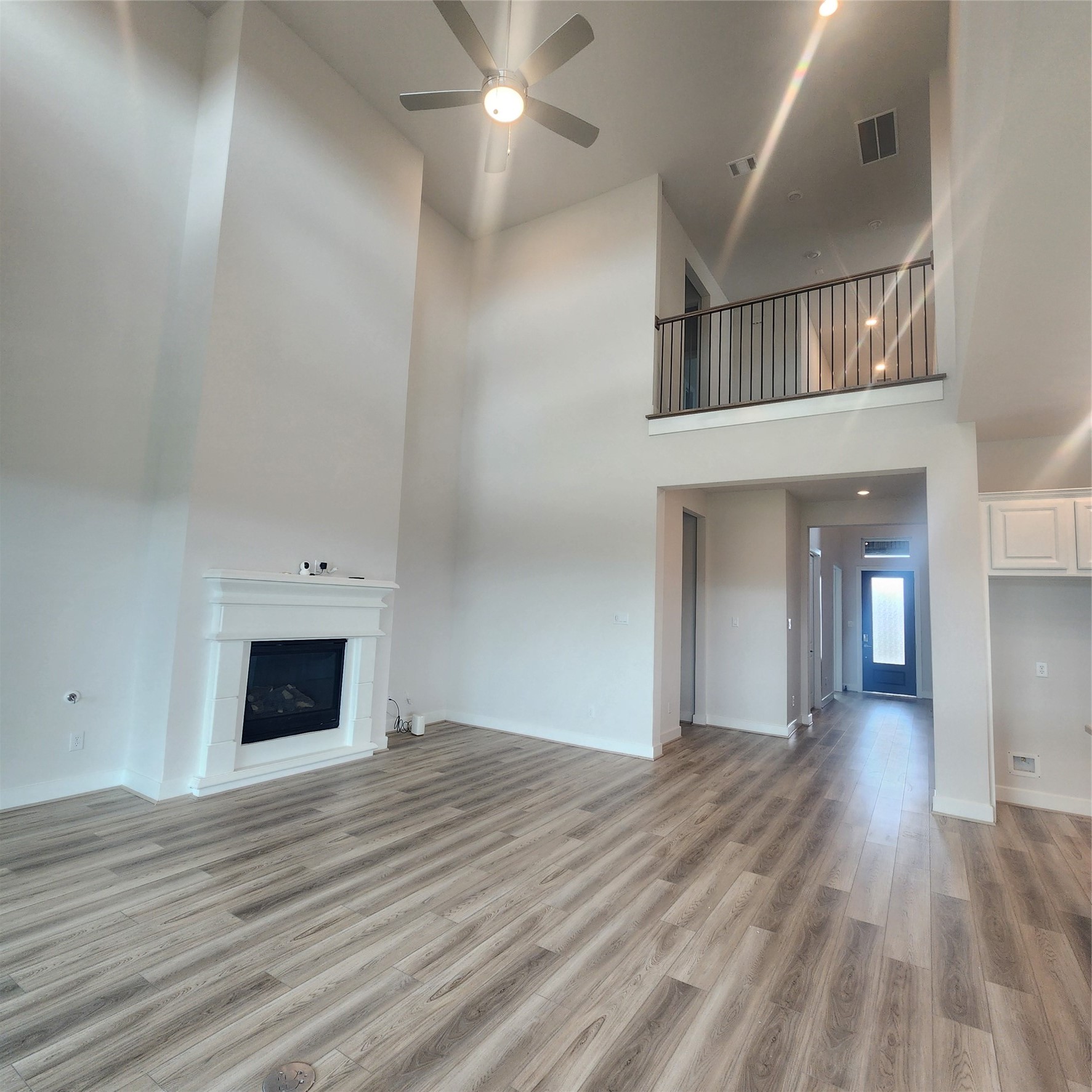 17507 Tulip Mdw Road Richmond, TX 77407 - Photo 14 of 47 wooden floor in an empty room with a fireplace
