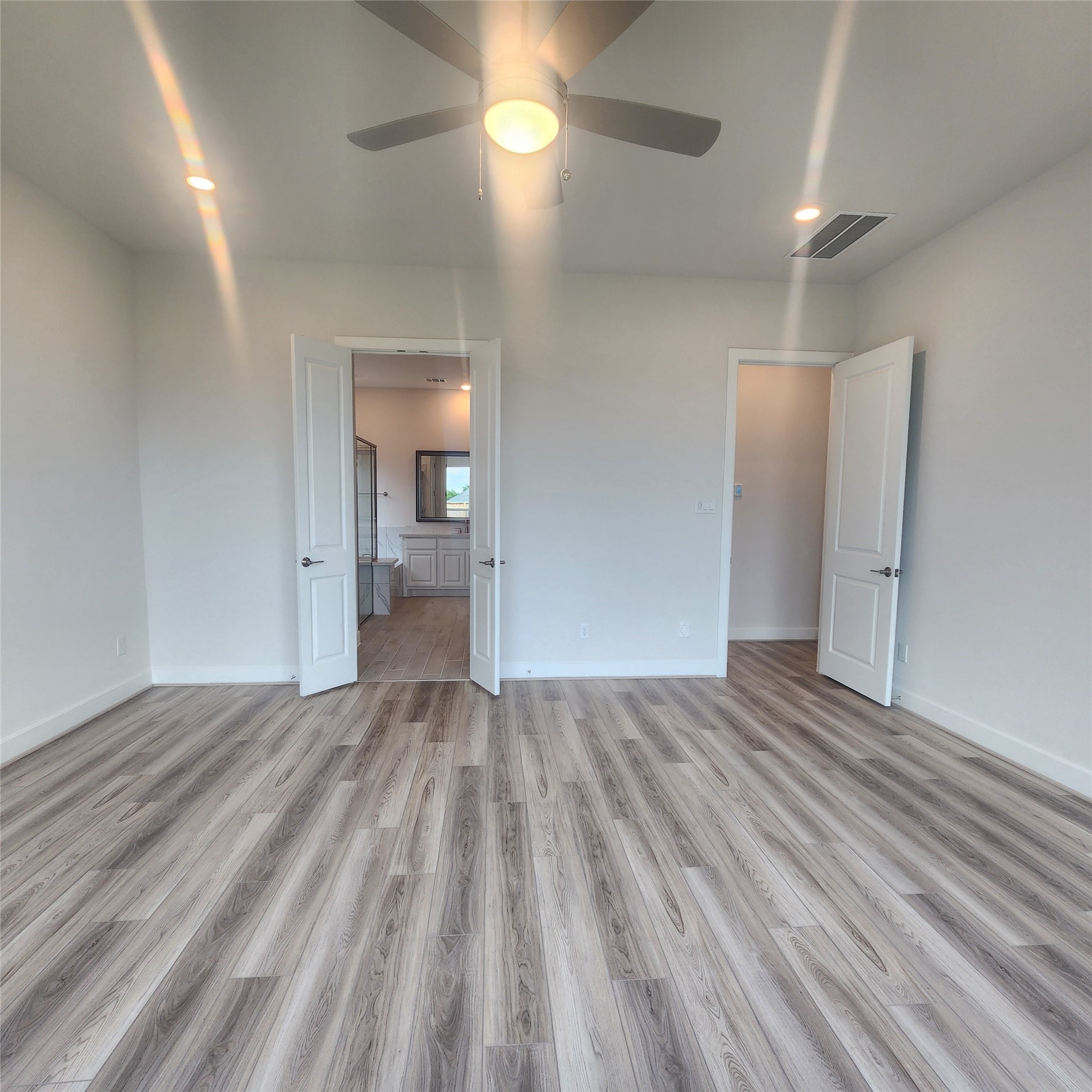 17507 Tulip Mdw Road Richmond, TX 77407 - Photo 17 of 47 an empty room with wooden floor and windows