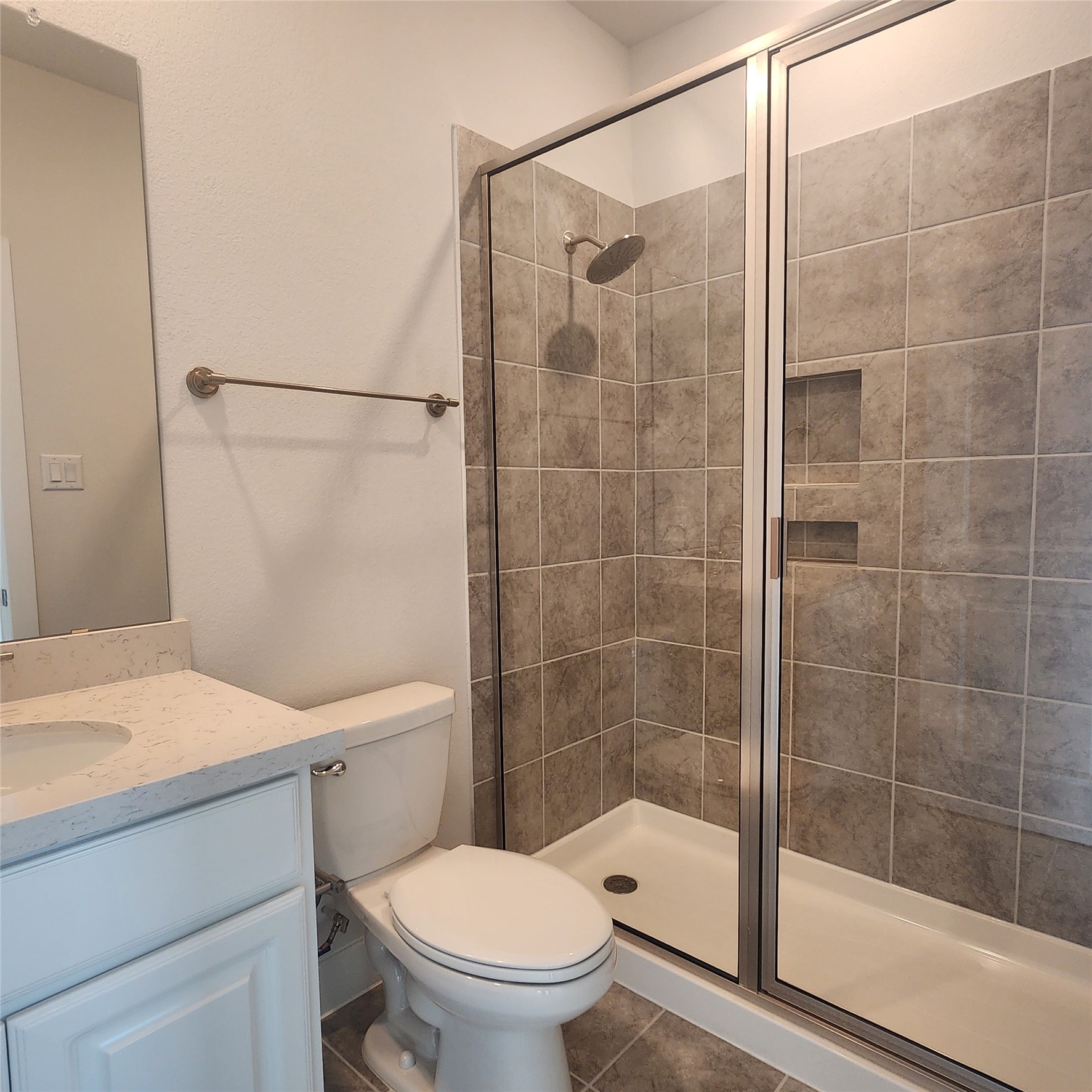 17507 Tulip Mdw Road Richmond, TX 77407 - Photo 27 of 47 a bathroom with a shower a toilet and a sink