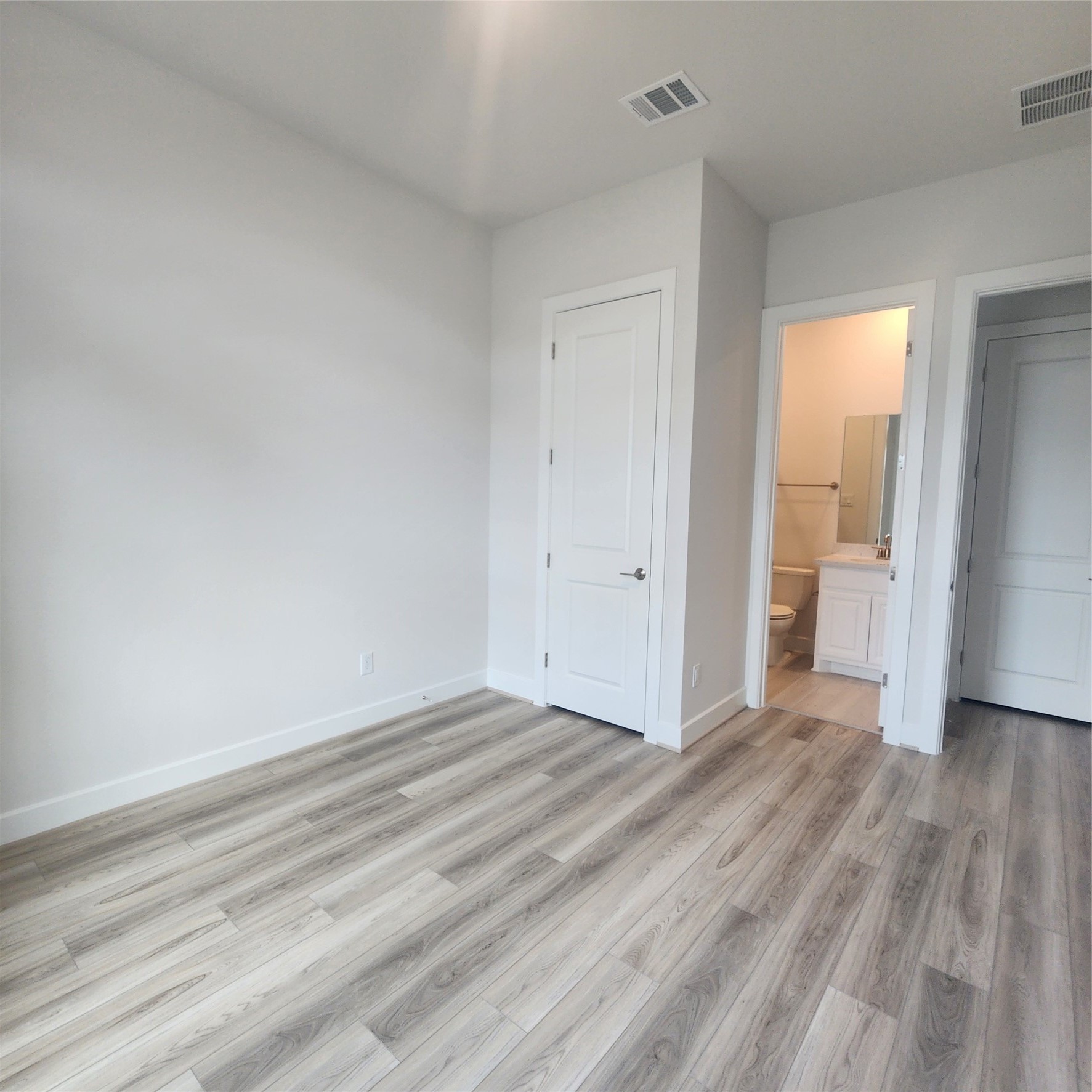 17507 Tulip Mdw Road Richmond, TX 77407 - Photo 34 of 47 an empty room with wooden floor and windows