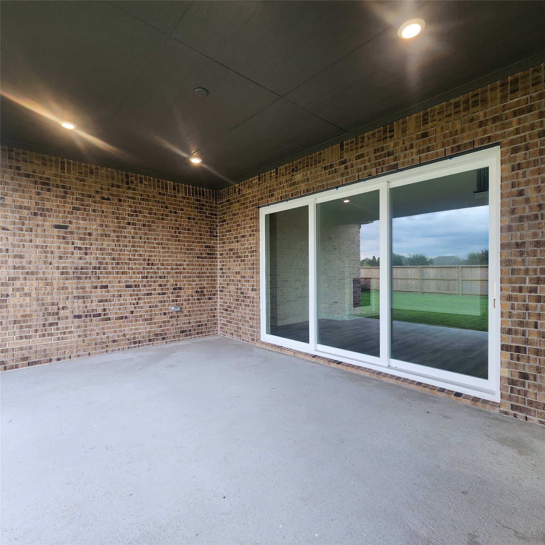 17507 Tulip Mdw Road Richmond, TX 77407 - Photo 39 of 47 a view of an empty room with a sliding door and wooden floor
