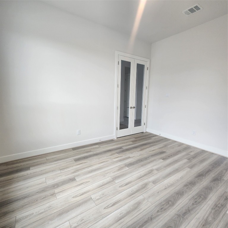 17507 Tulip Mdw Road Richmond, TX 77407 - Photo 4 of 47 a view of empty room with wooden floor