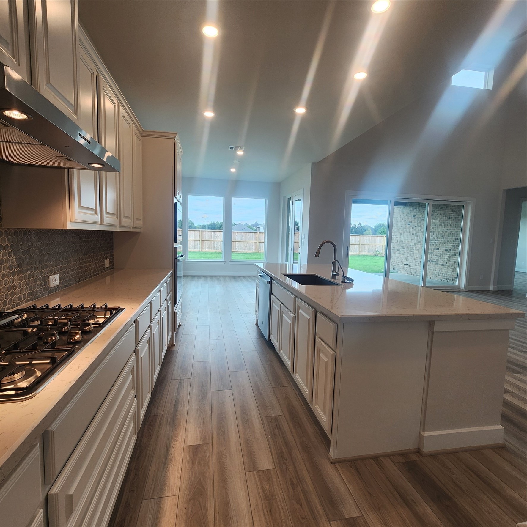 17507 Tulip Mdw Road Richmond, TX 77407 - Photo 8 of 47 a kitchen with counter top space and wooden floor