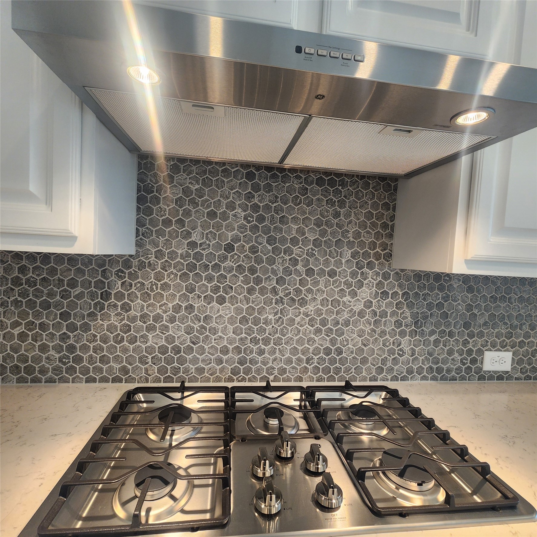 17507 Tulip Mdw Road Richmond, TX 77407 - Photo 9 of 47 a black and white stove top oven sitting inside of a kitchen