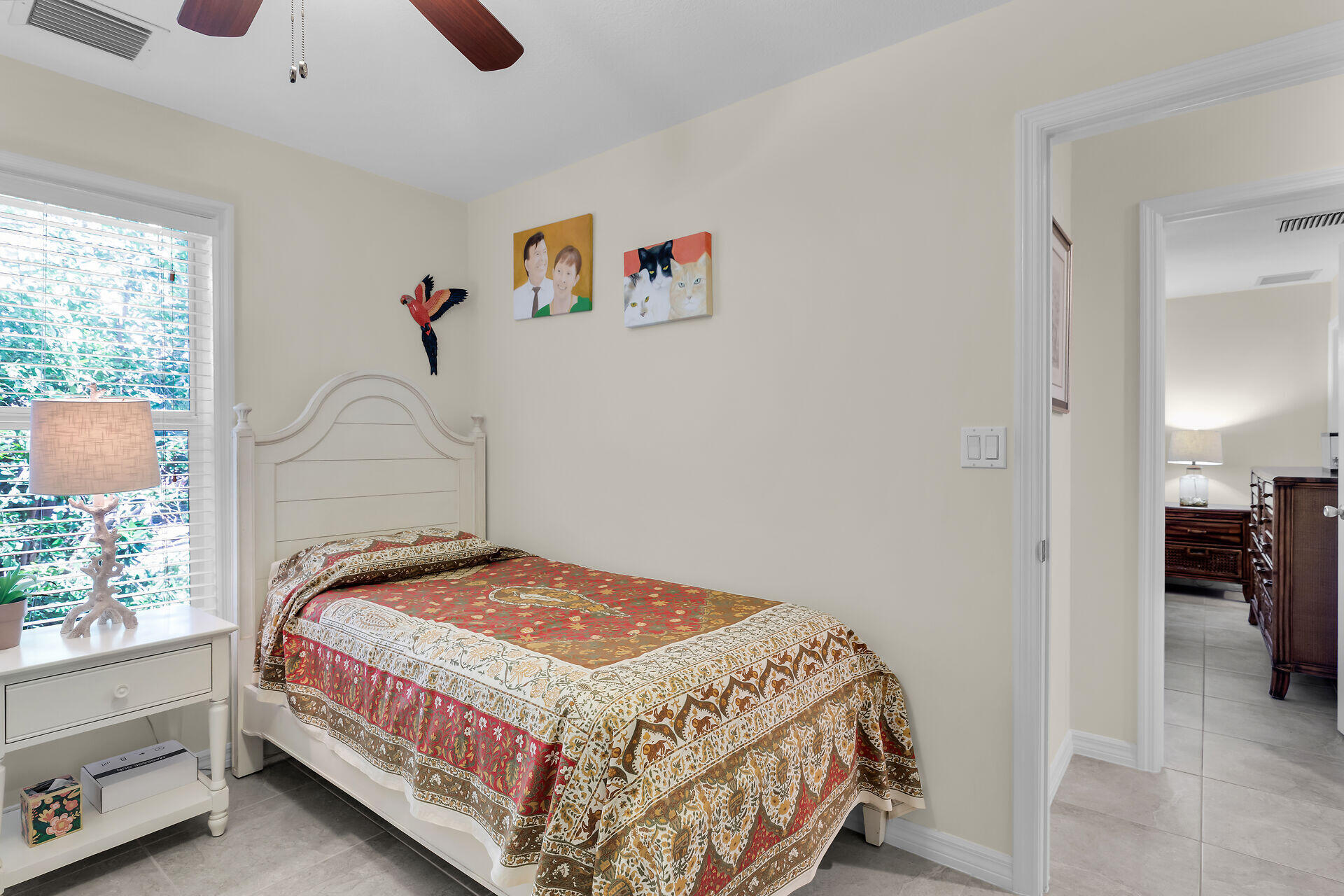 894 La Paloma Road Key Largo, FL 33037 - Photo 22 of 37 a bedroom with a bed and a window