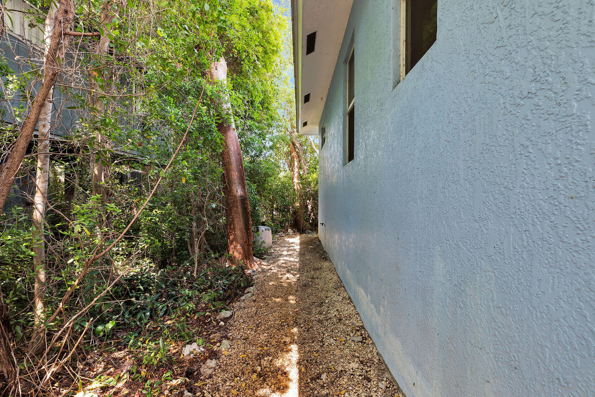 894 La Paloma Road Key Largo, FL 33037 - Photo 30 of 37 a view of a pathway both side of house