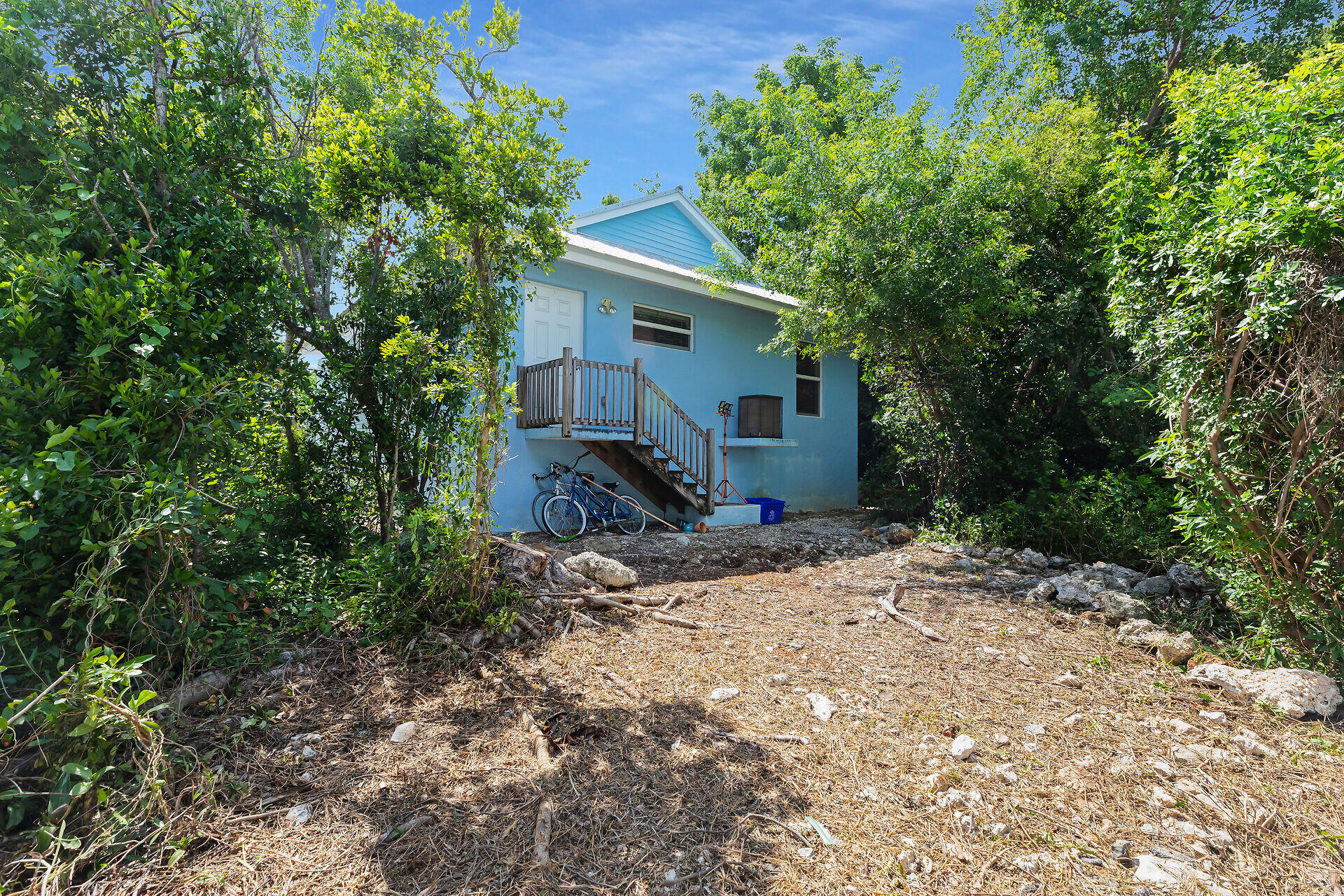 894 La Paloma Road Key Largo, FL 33037 - Photo 32 of 37 a view of house with trees in the background