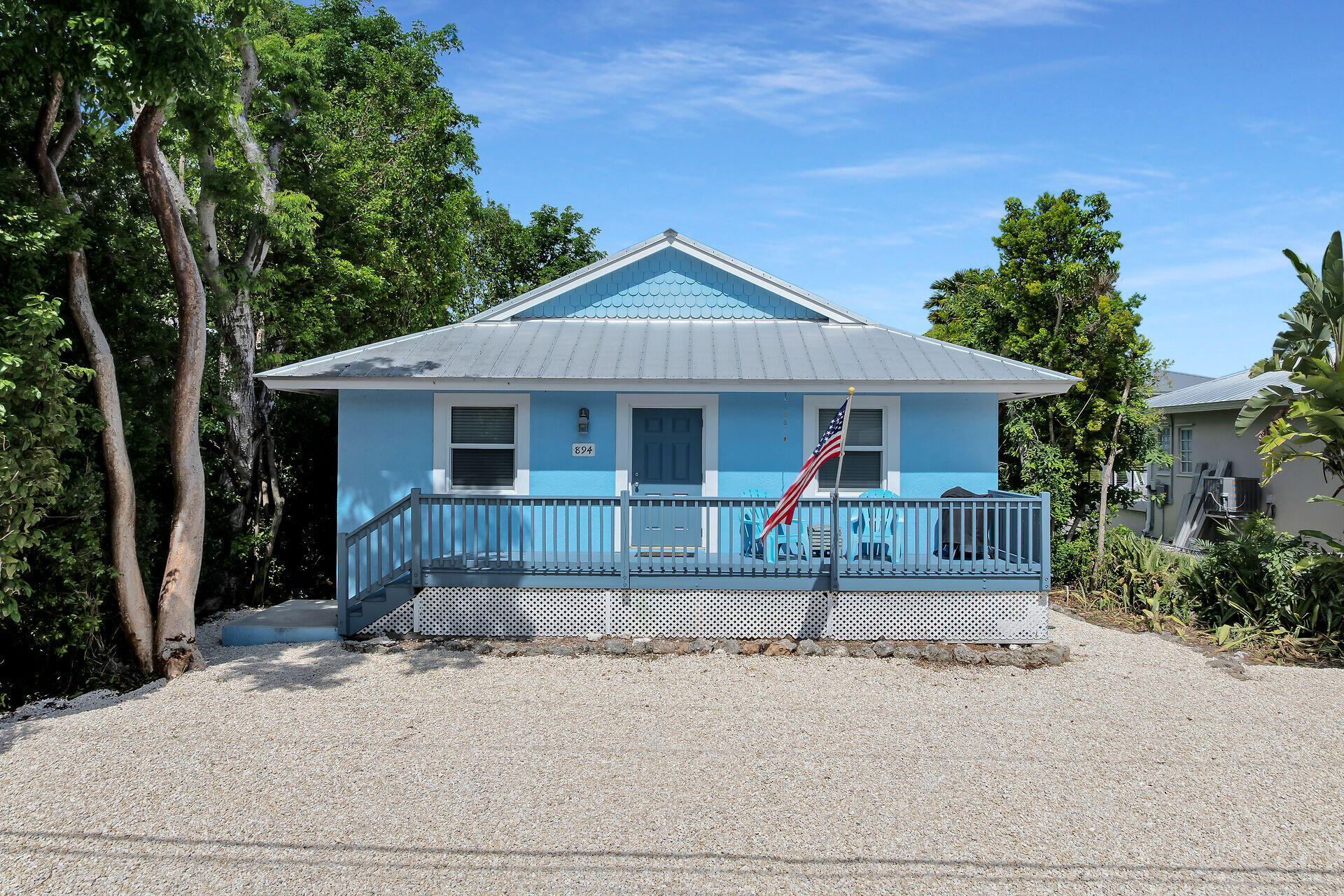 894 La Paloma Road Key Largo, FL 33037 - Photo 37 of 37 front view of a house with small yard