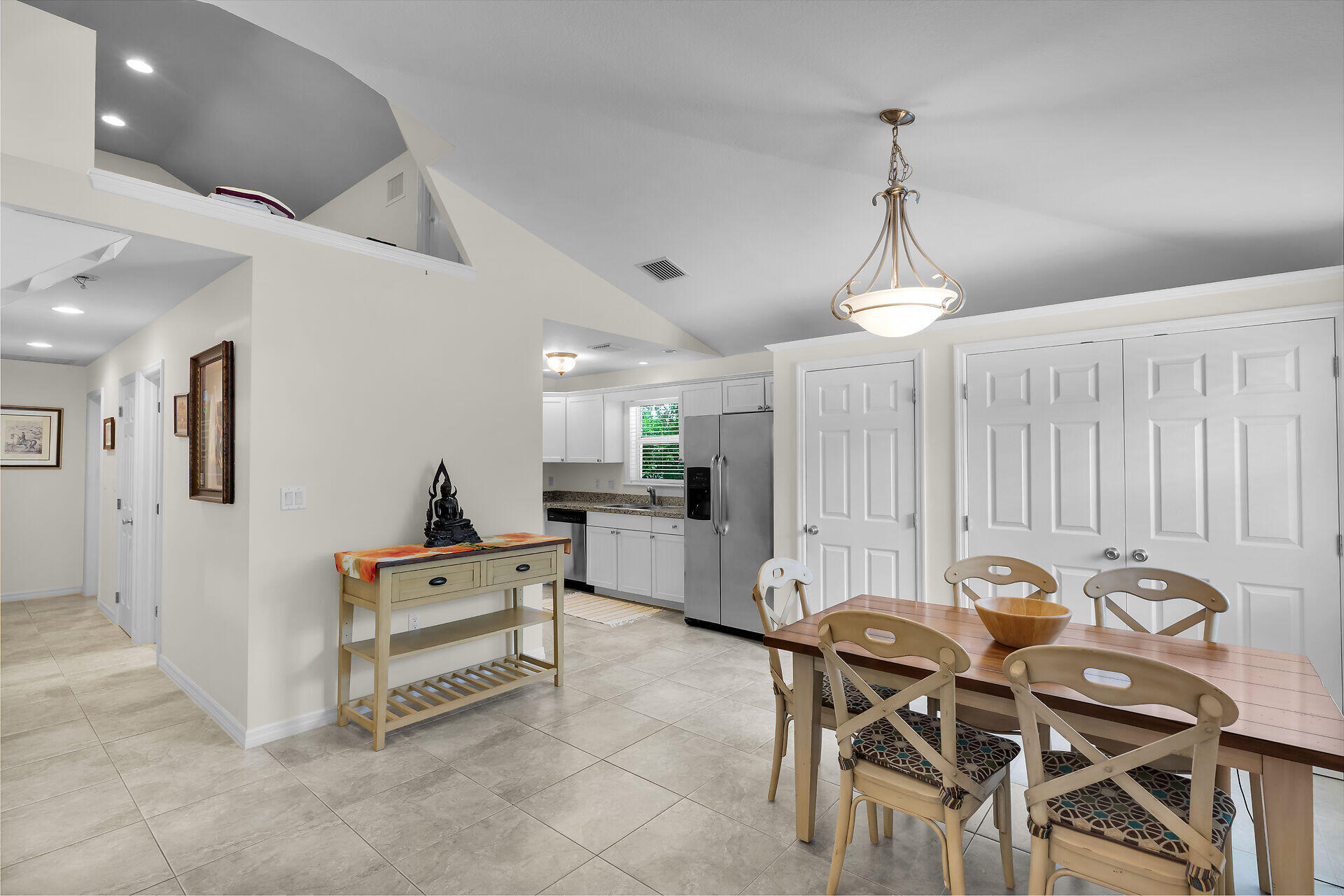 894 La Paloma Road Key Largo, FL 33037 - Photo 9 of 37 a view of table and chairs in kitchen