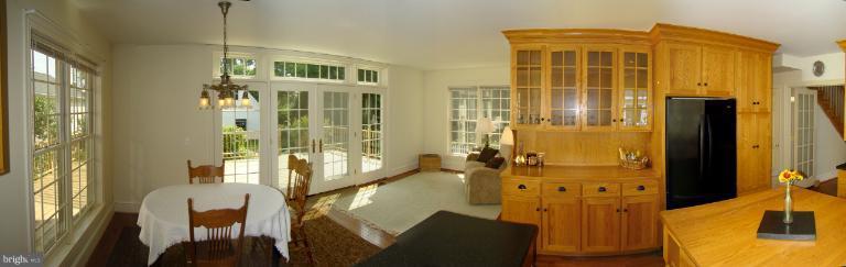 106 Central Avenue Ridgely, MD 21660 - Photo 18 of 30 Kitchen & Adjoining Sunroom