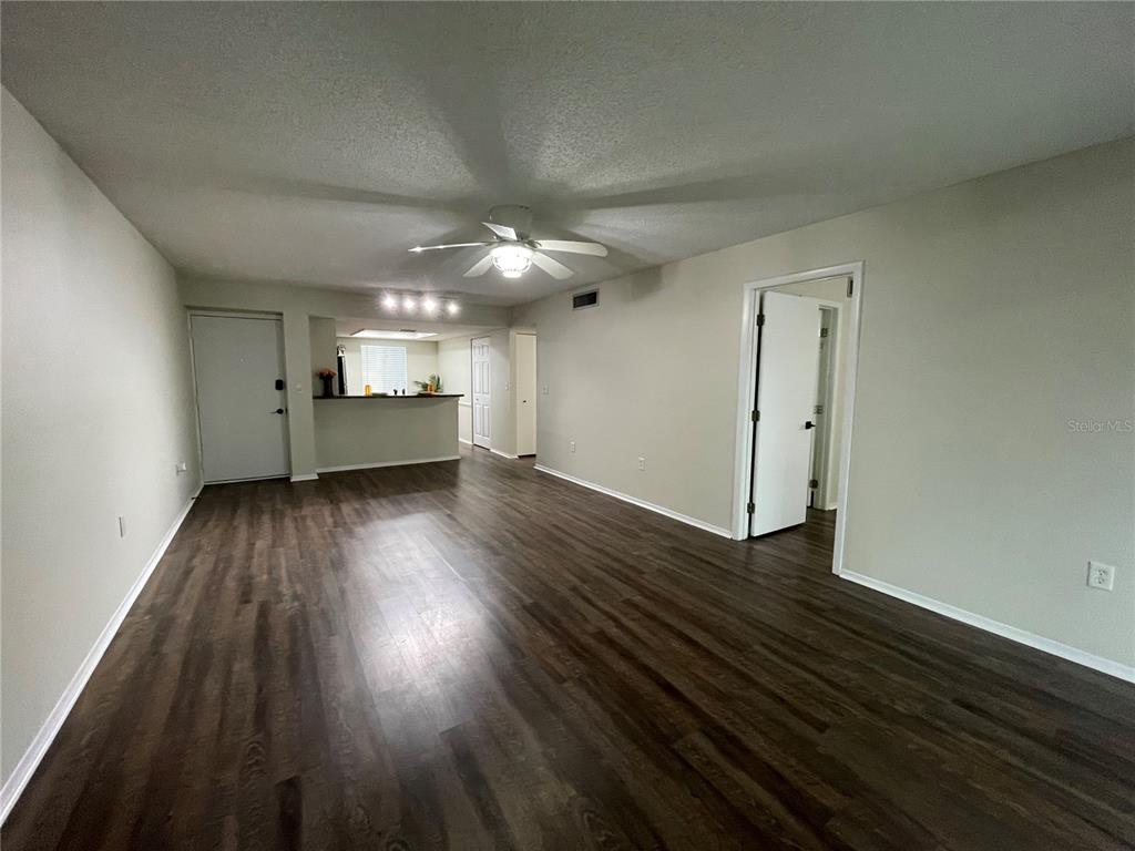 112 Palmetto Court, Unit 112 Oldsmar, FL 34677 - Photo 14 of 46 wooden floor in an empty room with a window