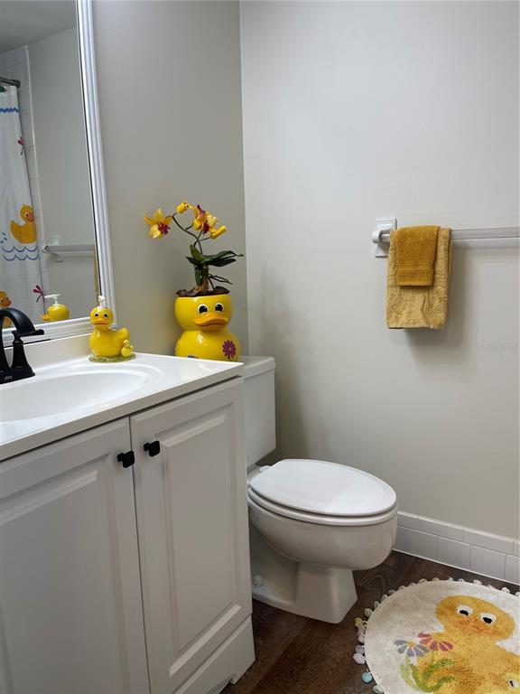 112 Palmetto Court, Unit 112 Oldsmar, FL 34677 - Photo 17 of 46 a bathroom with a toilet sink and mirror