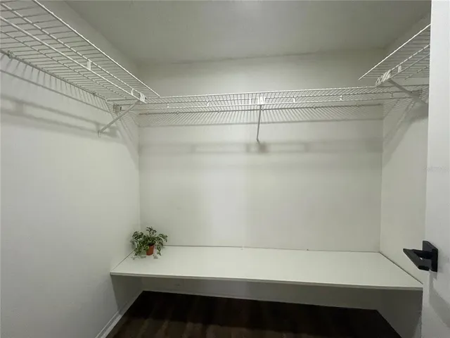 a view of a room with racks on the wall