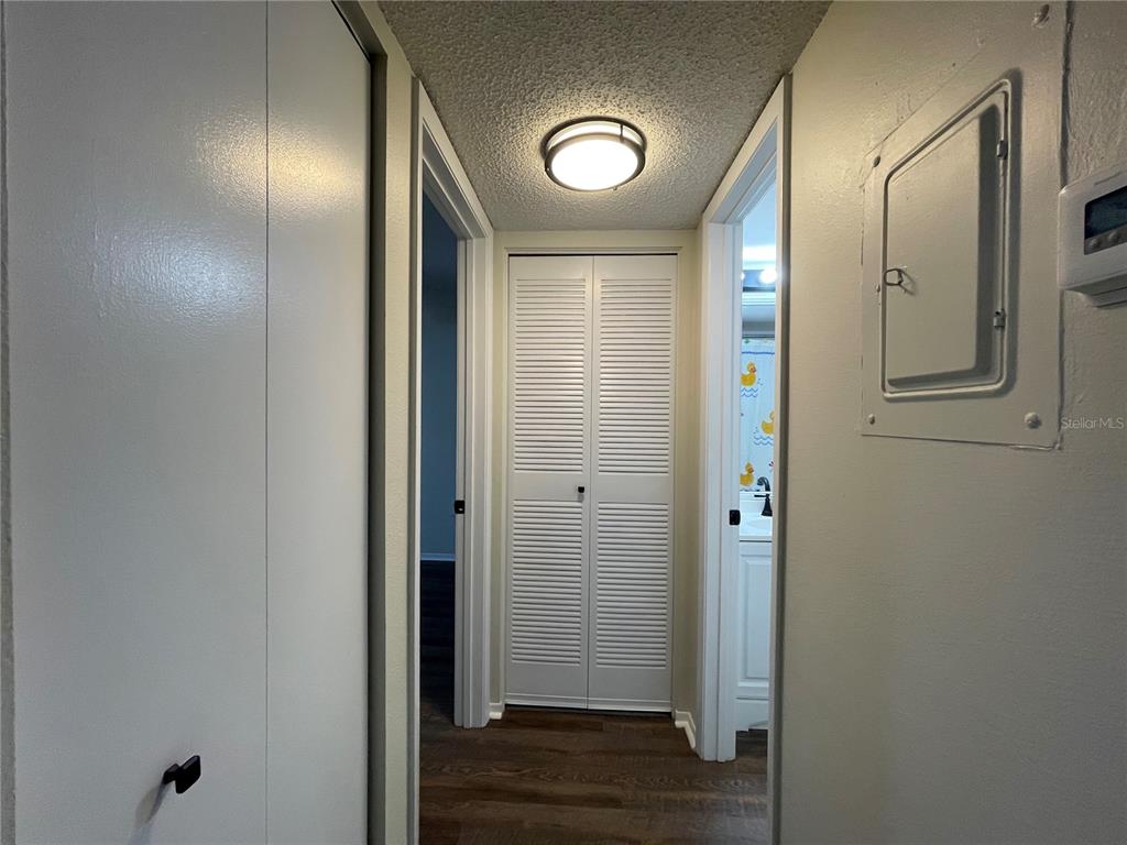 112 Palmetto Court, Unit 112 Oldsmar, FL 34677 - Photo 35 of 46 an empty room with wooden floor and mirror
