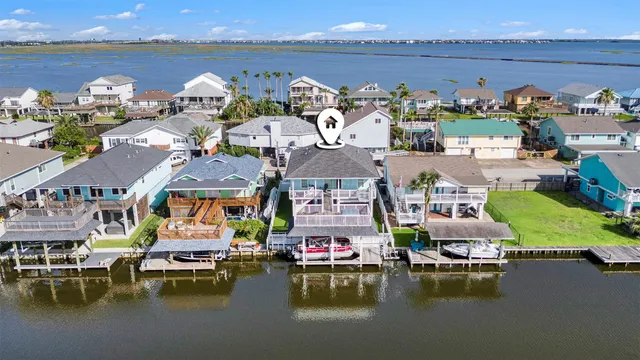a view of a lake with lawn chairs