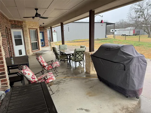 a terrace with outdoor seating and city view