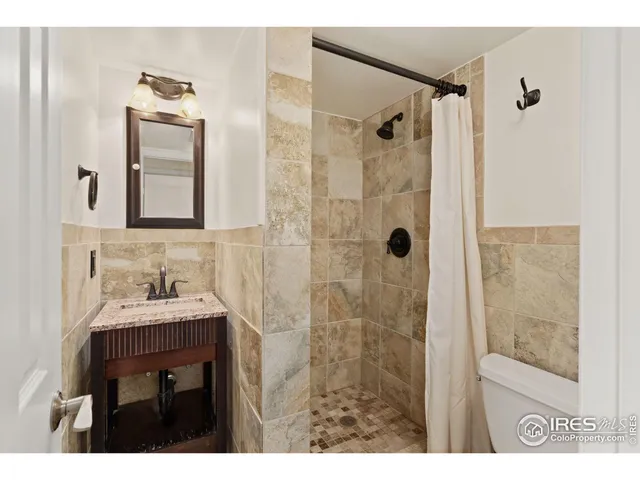 a view of a bathroom from a hallway