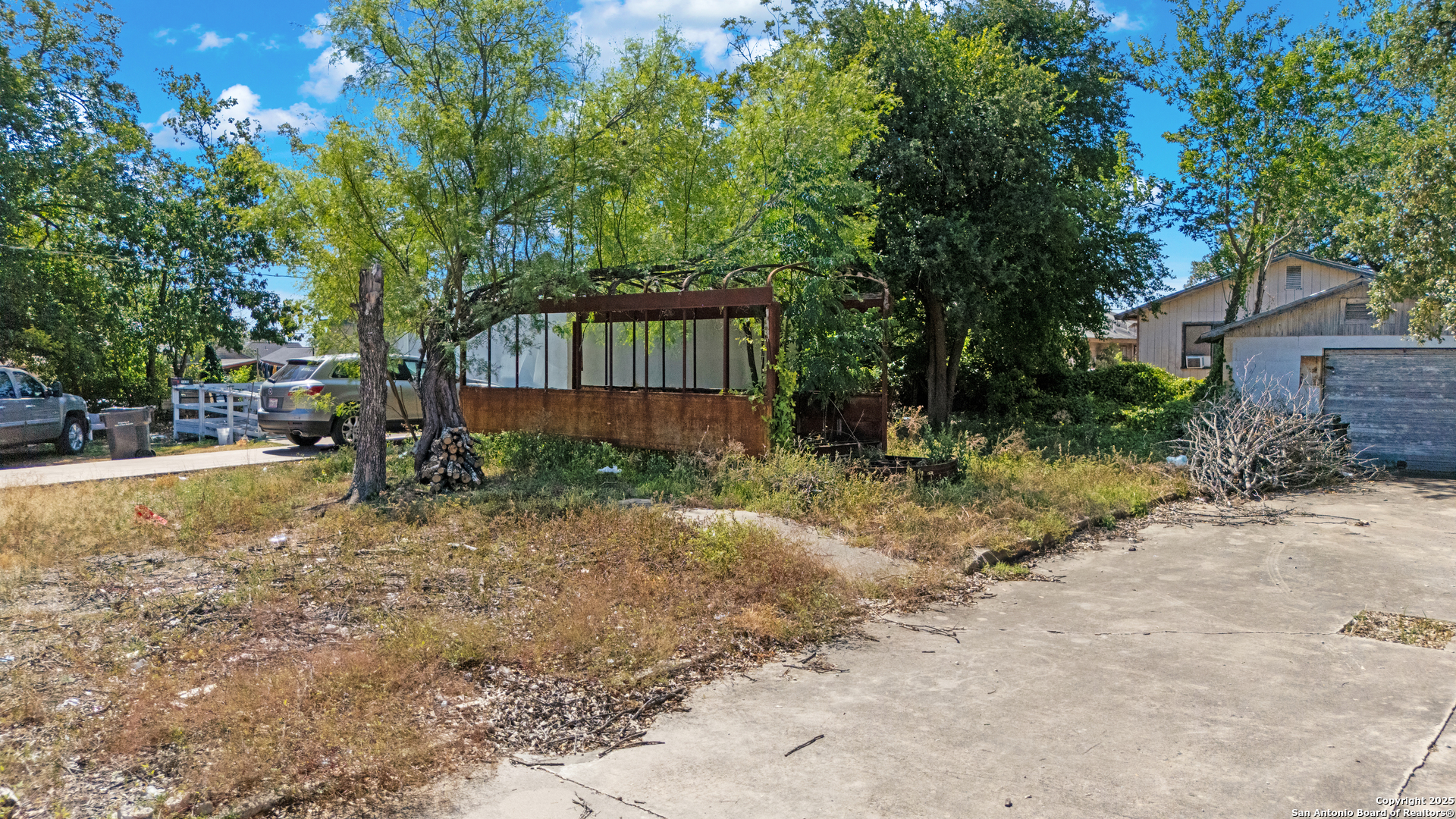 1328 Rigsby Avenue San Antonio, TX 78210 - Photo 16 of 18 a view of a backyard with large trees