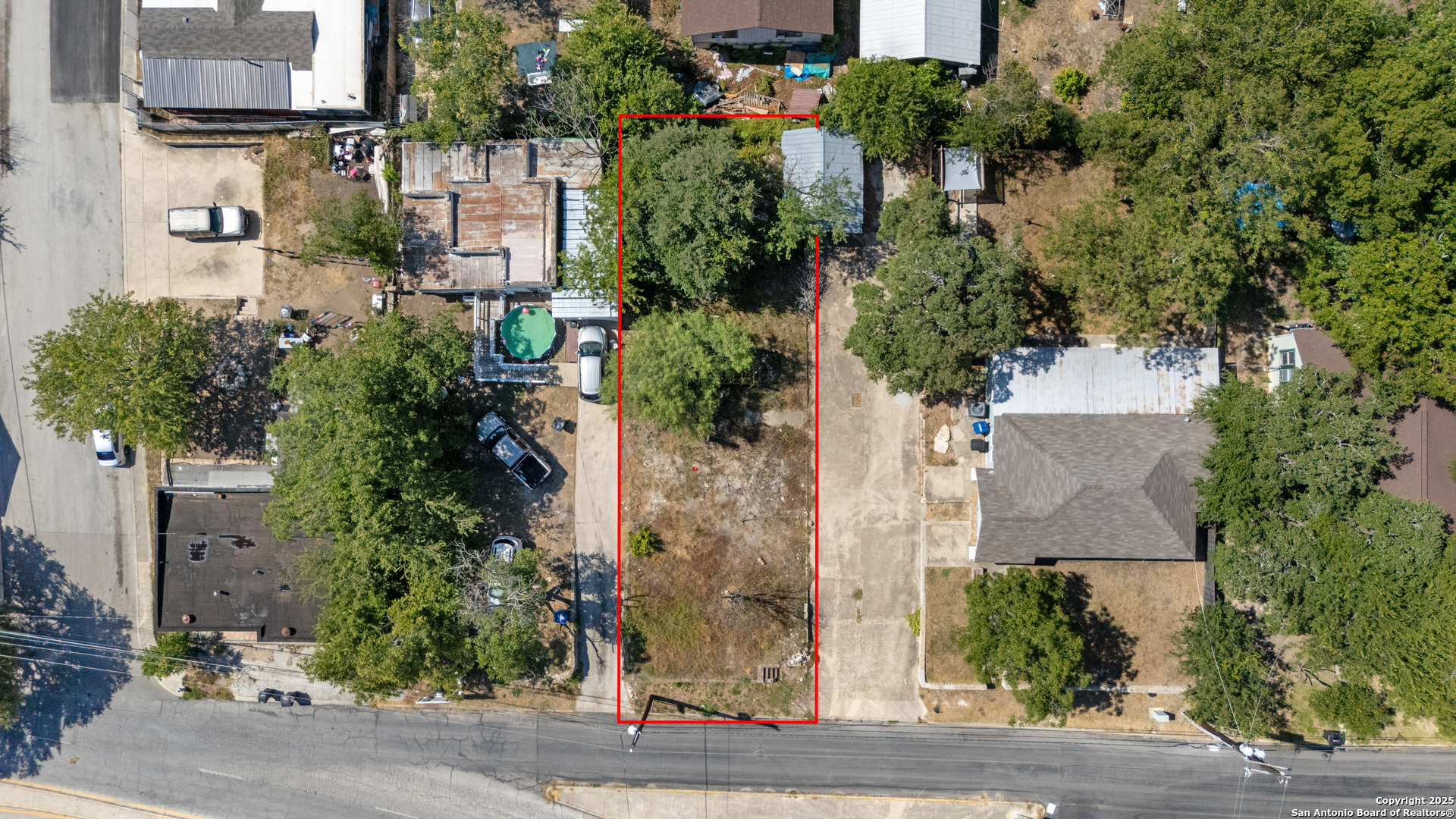 1328 Rigsby Avenue San Antonio, TX 78210 - Photo 10 of 18 an aerial view of a house with a yard and large trees
