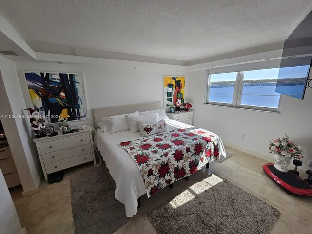 a bedroom with a bed and closet