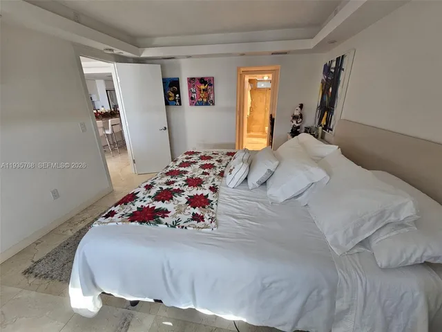 a bedroom with bed and a window