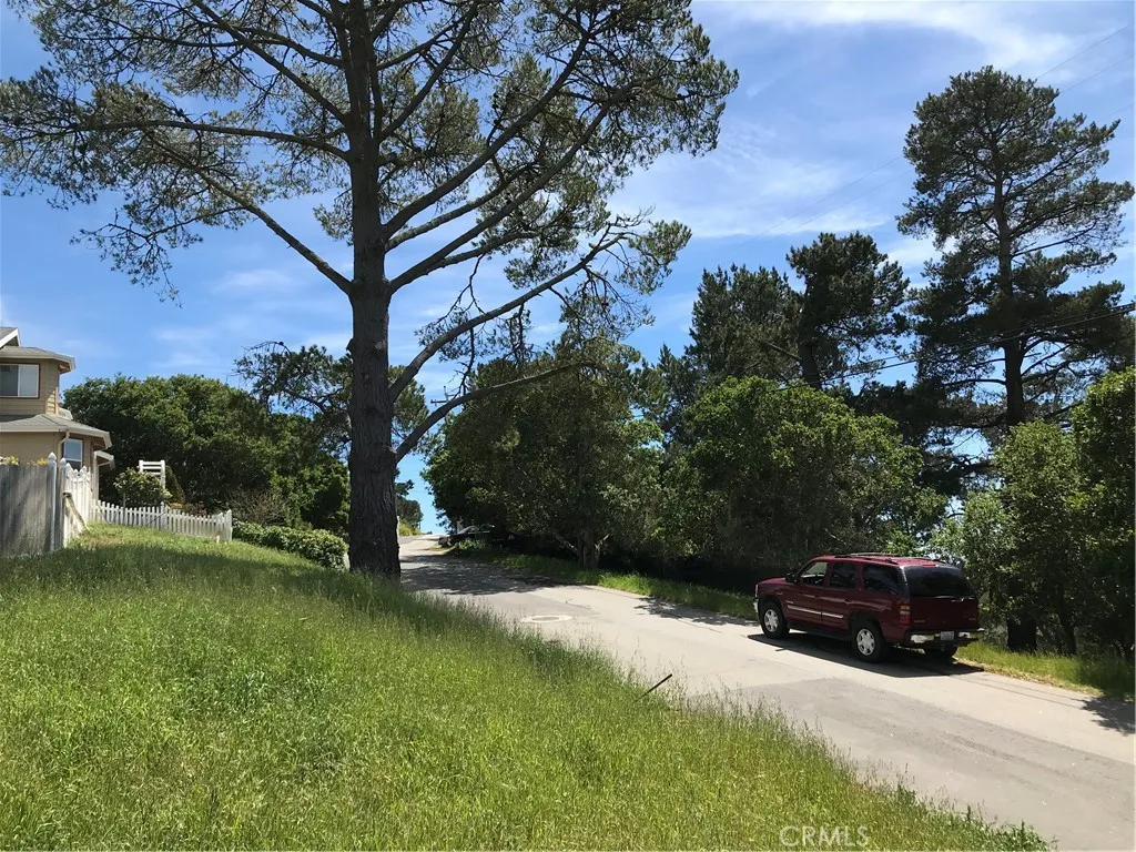 0 Richard Cambria, CA 93428 - Photo 3 of 7 a car parked in front of yellow house