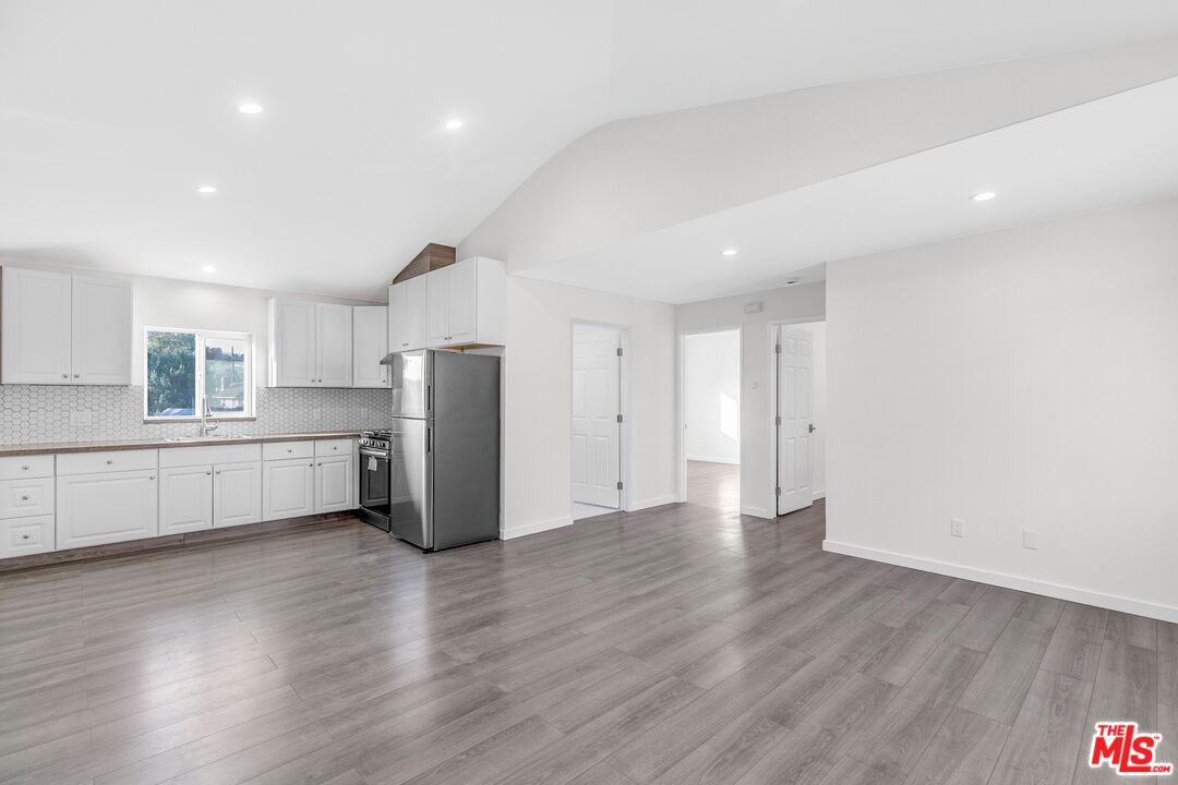 3509 Kinney Street Los Angeles, CA 90065 - Photo 2 of 12 a view of a kitchen with refrigerator and wooden floor