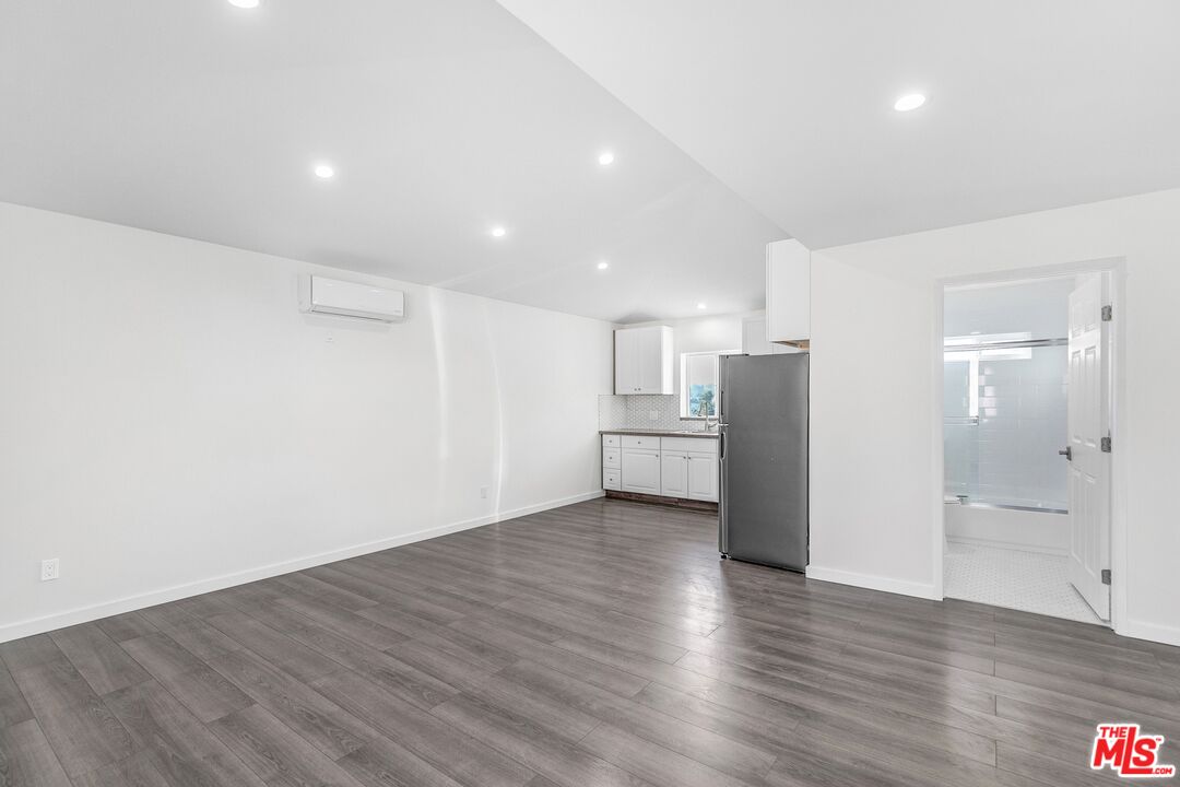 3509 Kinney Street Los Angeles, CA 90065 - Photo 3 of 12 a view of a kitchen with refrigerator and wooden floor