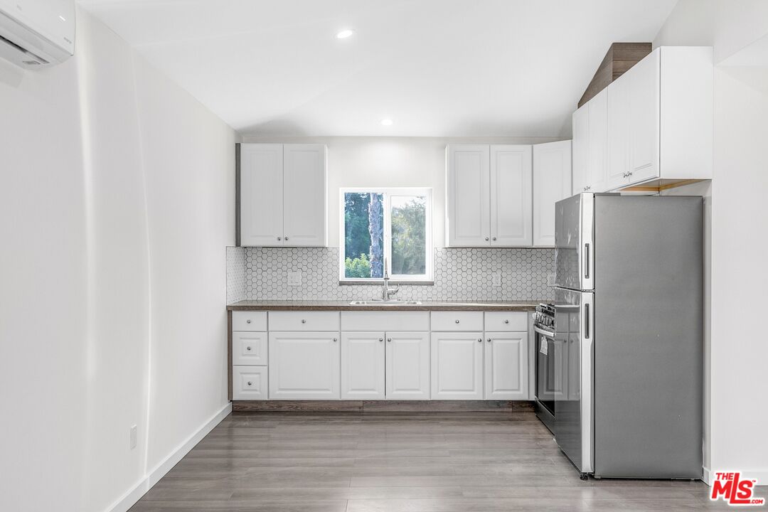 3509 Kinney Street Los Angeles, CA 90065 - Photo 4 of 12 a kitchen with stainless steel appliances granite countertop a refrigerator and a sink
