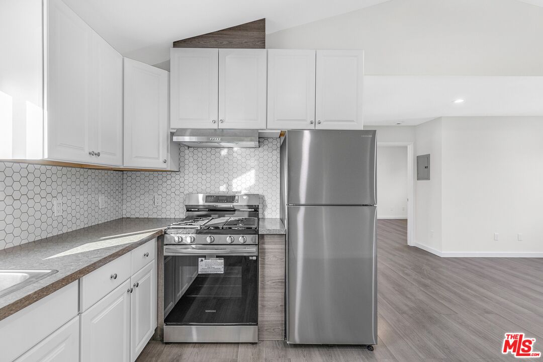 3509 Kinney Street Los Angeles, CA 90065 - Photo 5 of 12 a kitchen with a white cabinets and white appliances