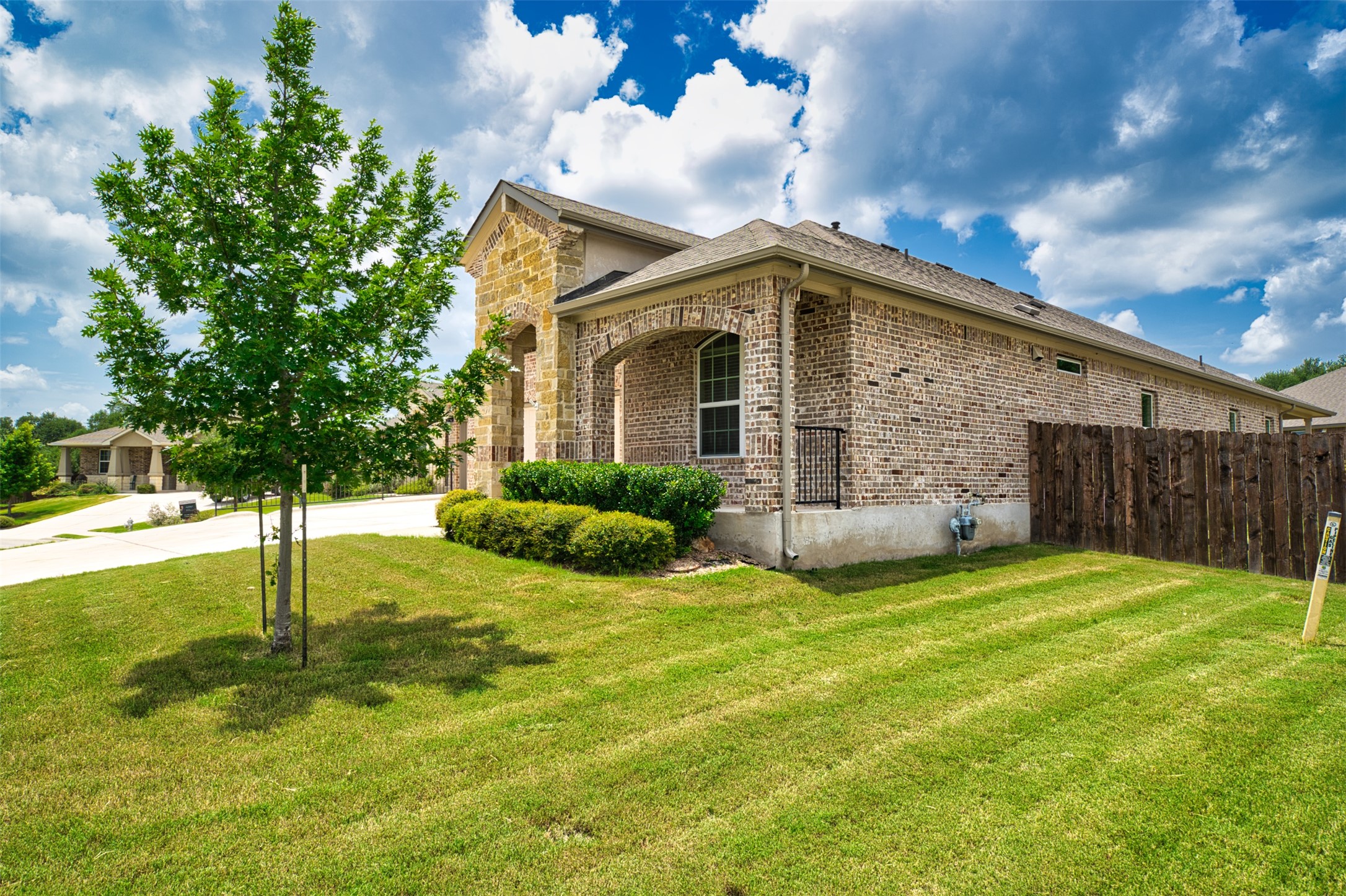 4125 Buffalo Ford Road Georgetown, TX 78628 - Photo 3 of 28 View of home's exterior with brick siding, stone siding, and driveway
