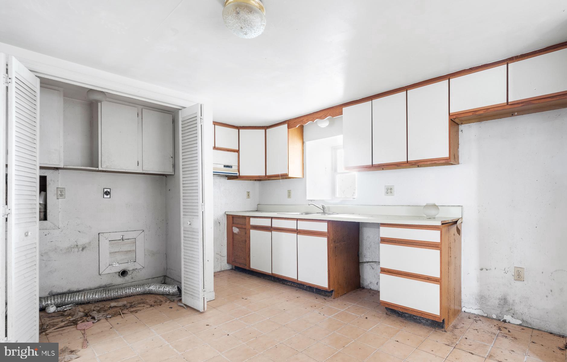 2481 Summit Point Road Summit Point, WV 25446 - Photo 20 of 35 a kitchen with stainless steel appliances granite countertop a refrigerator sink and cabinets