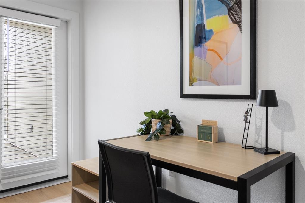 596 West 9th Street, Unit 320 Dallas, TX 75208 - Photo 21 of 22 a view of a workspace with furniture