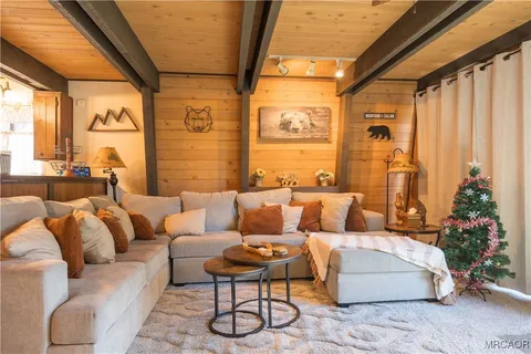 a view of a livingroom with furniture and a fireplace