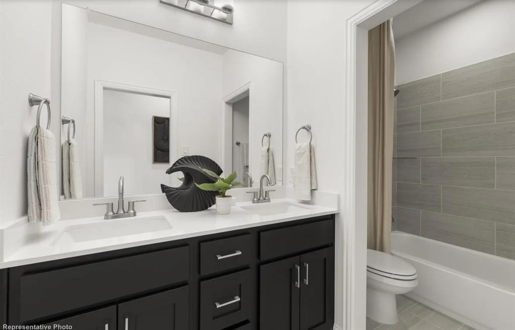 2504 Sturgis Street Forney, TX 75126 - Photo 20 of 24 a bathroom with a granite countertop sink and a mirror