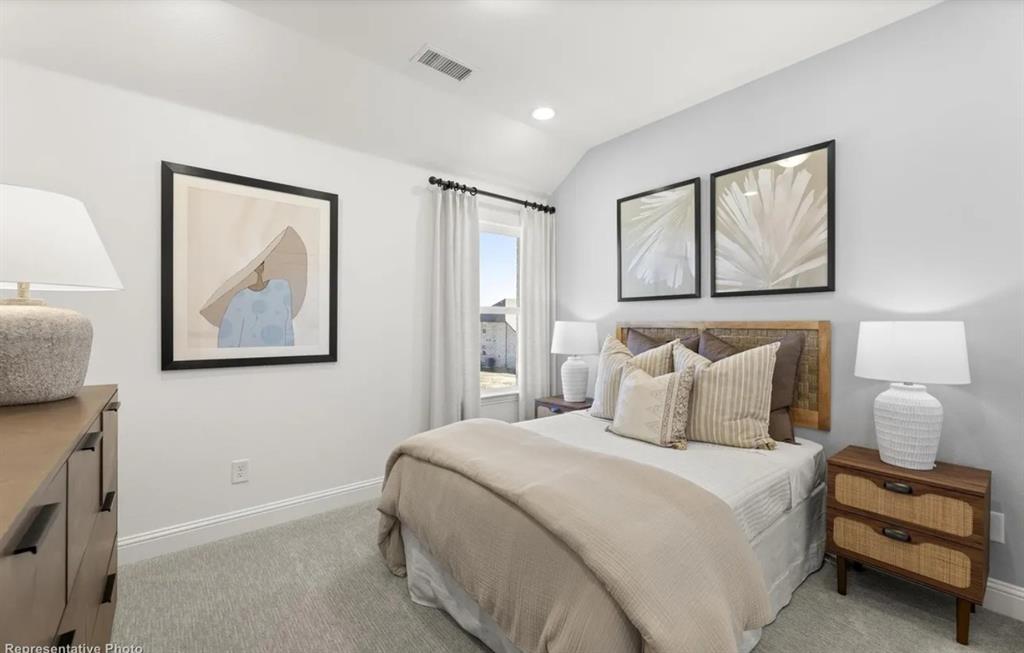 2504 Sturgis Street Forney, TX 75126 - Photo 22 of 24 a bedroom with a bed and a painting on the wall