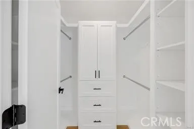 a en suite bathroom with a tub sink and mirror