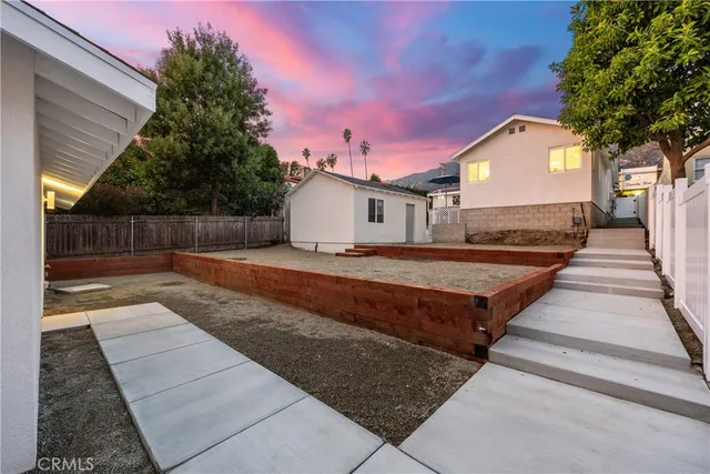 a view of a house with a mountain in the background
