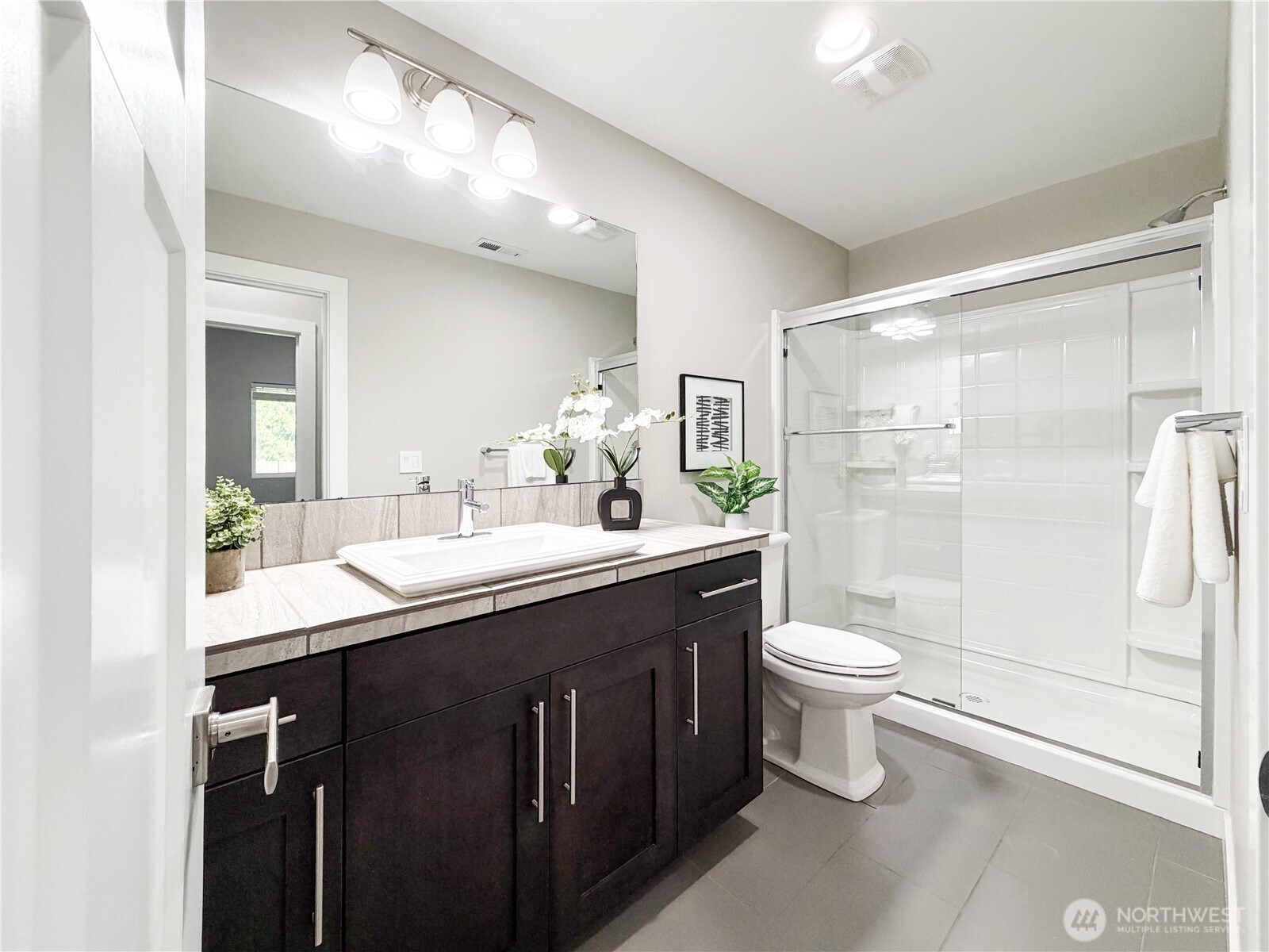 22724 41st Drive Southeast Bothell, WA 98021 - Photo 37 of 40 a bathroom with a double vanity sink toilet and shower
