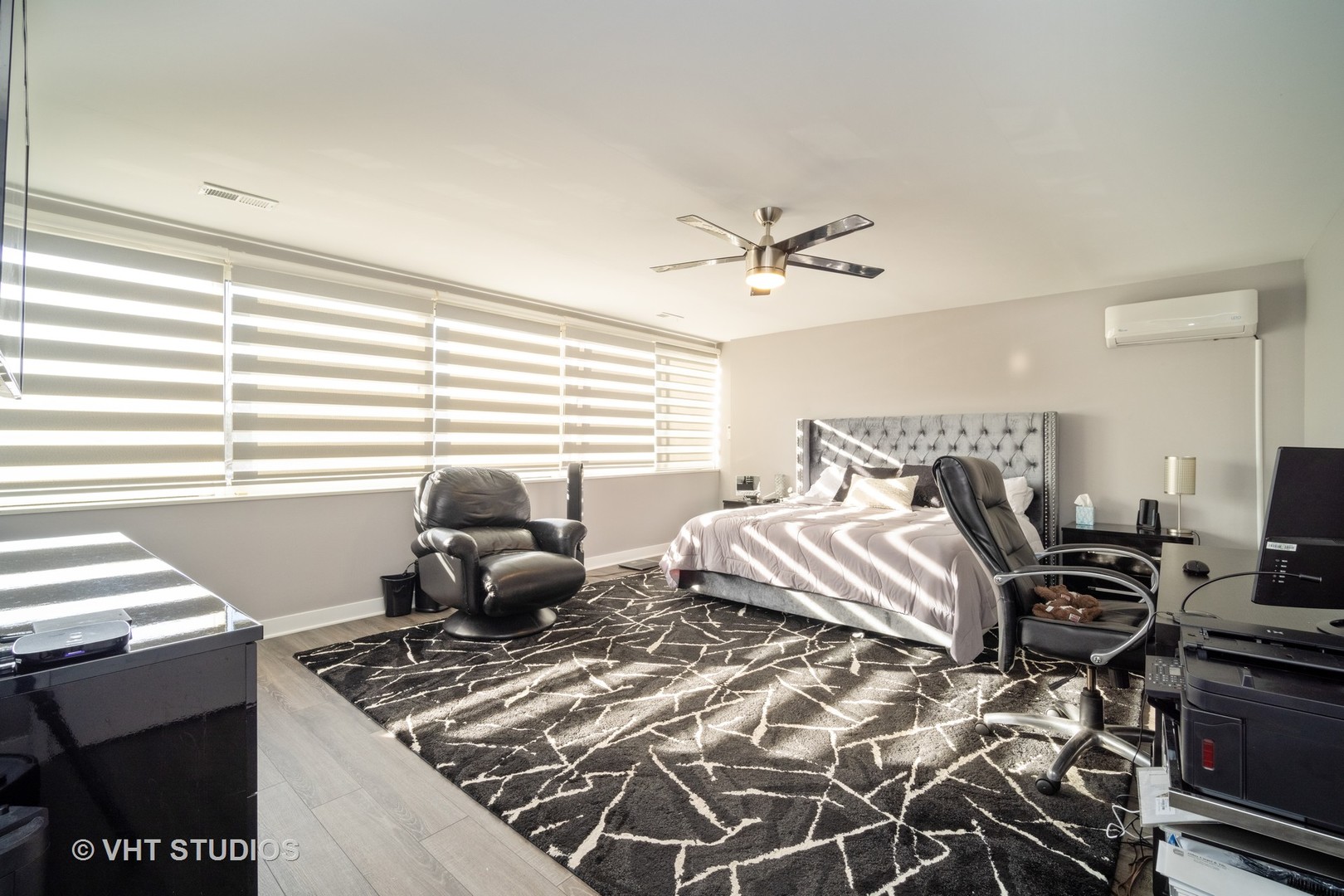 15 Wellington Road Northbrook, IL 60062 - Photo 10 of 19 a bedroom with a bed and a chandelier