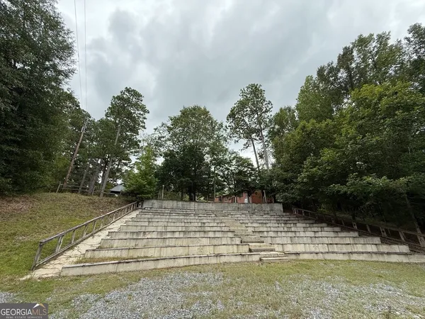 a view of an empty room with stairs