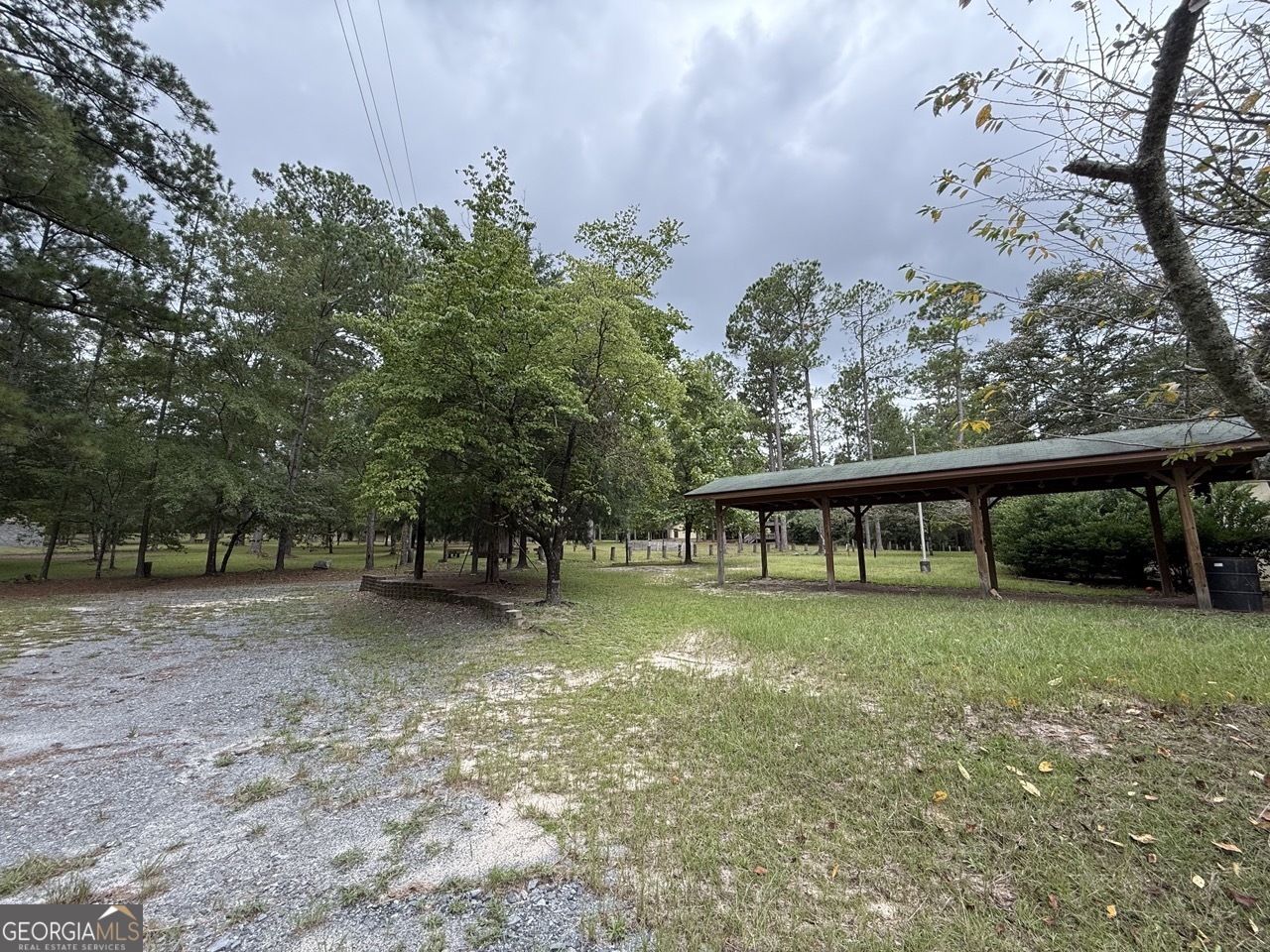 2251 Boy Scout Road Byron, GA 31008 - Photo 18 of 46 a view of a backyard with large trees