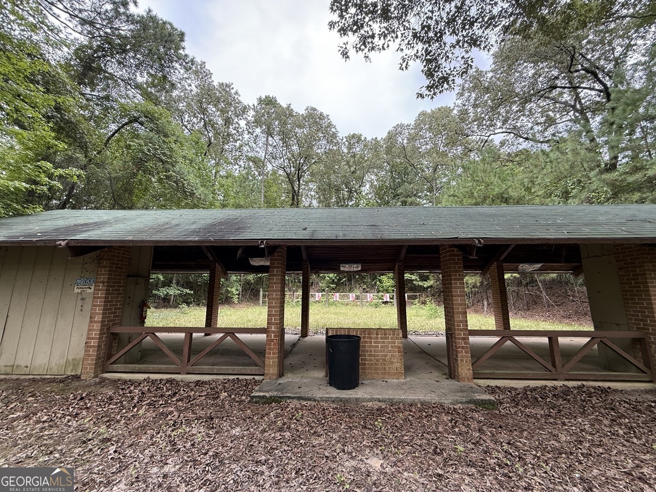 2251 Boy Scout Road Byron, GA 31008 - Photo 29 of 46 a view of a patio with table and chairs a barbeque with wooden fence and floor