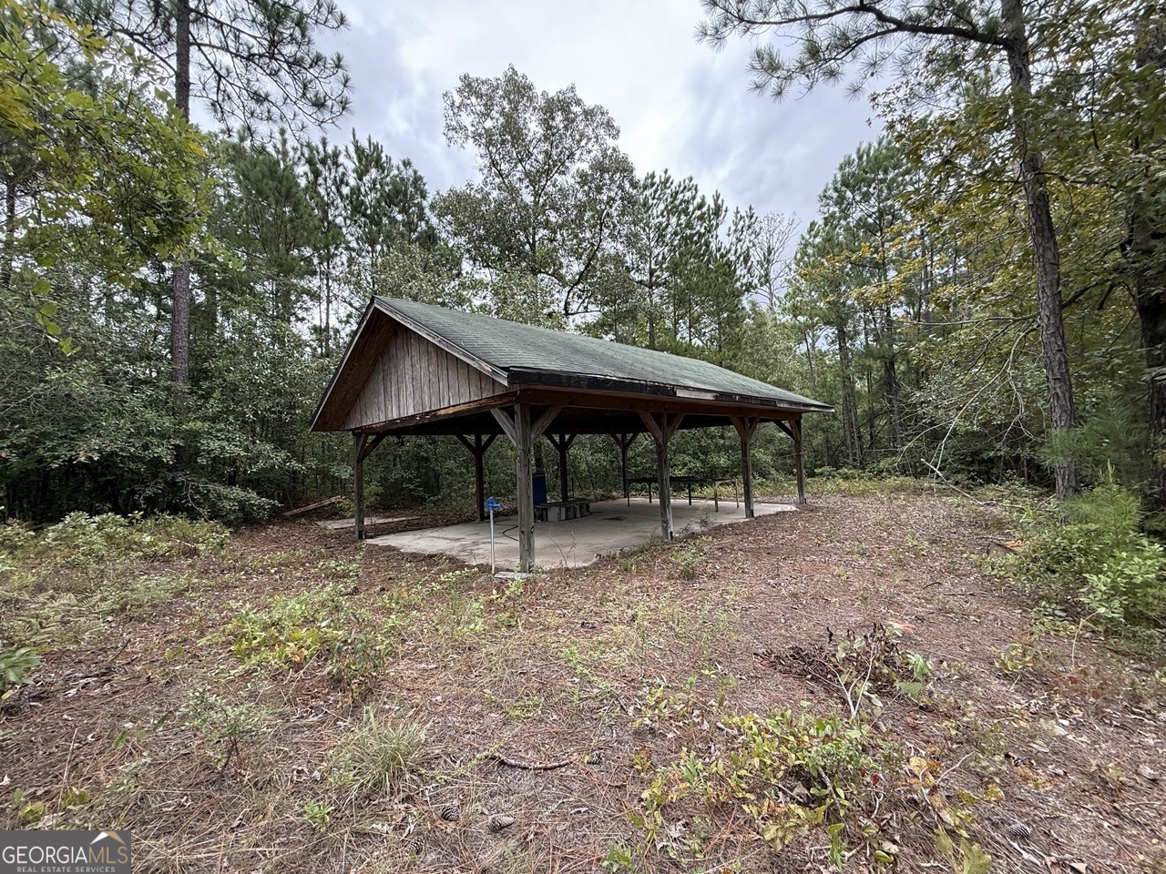 2251 Boy Scout Road Byron, GA 31008 - Photo 34 of 46 a backyard of a house with wooden deck and backyard