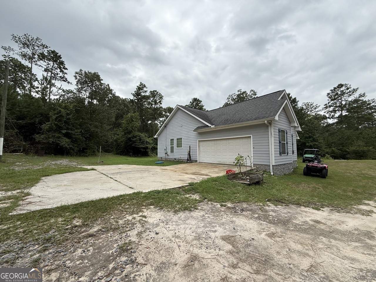 2251 Boy Scout Road Byron, GA 31008 - Photo 4 of 46 a view of a house with a yard and large tree