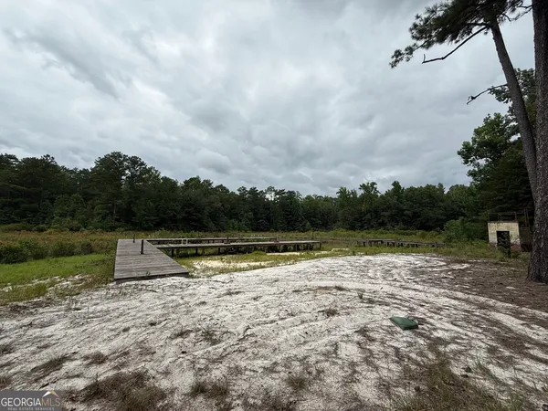 a view of a lake with houses in the back