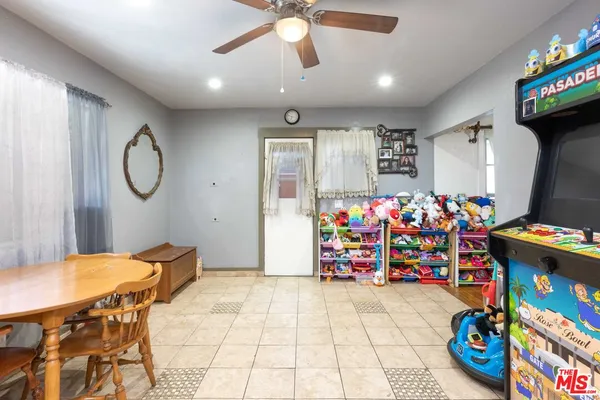 a outdoor dining space with furniture and chandelier