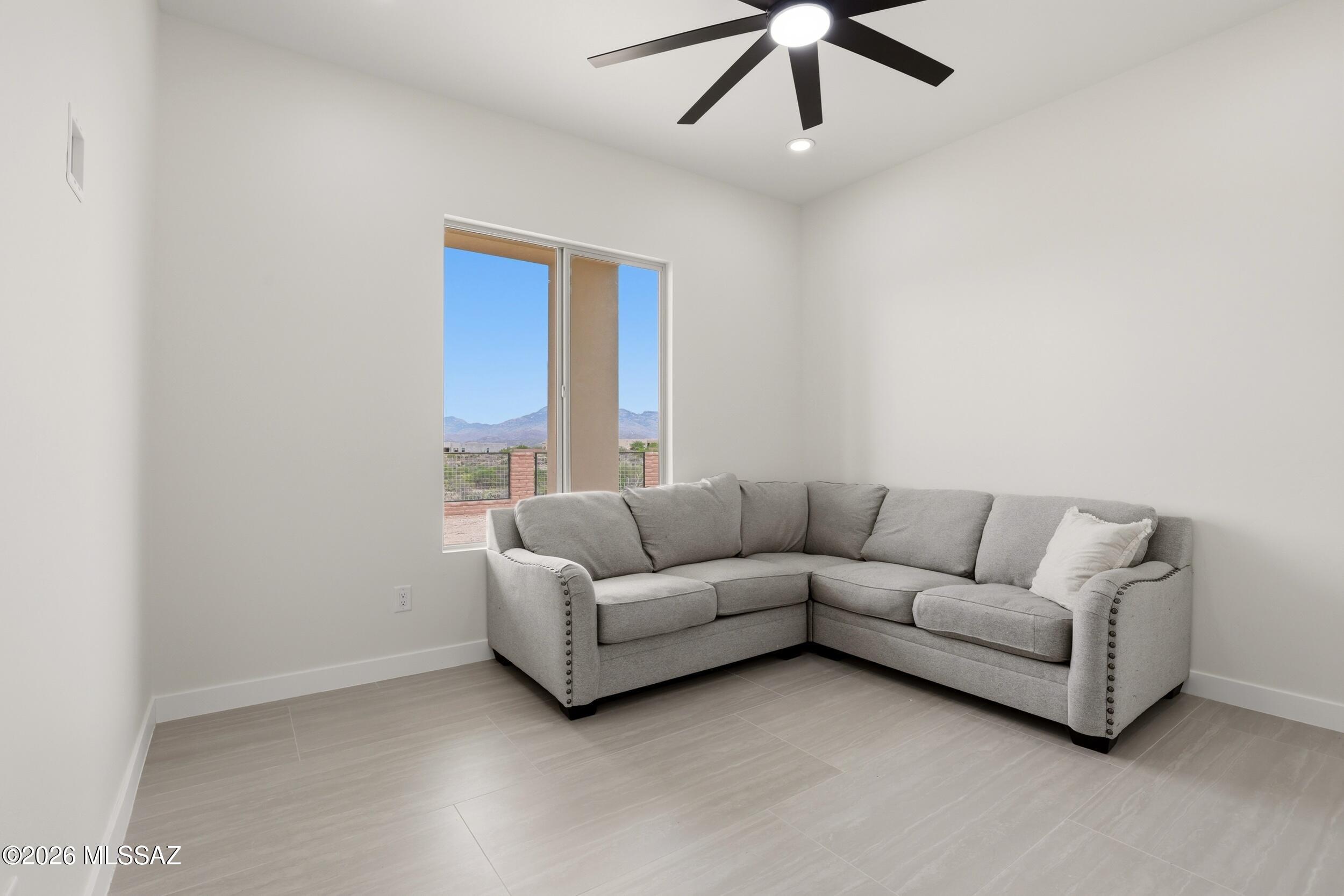 14527 East Sands Ranch Road Vail, AZ 85641 - Photo 34 of 48 a living room with furniture and a ceiling fan