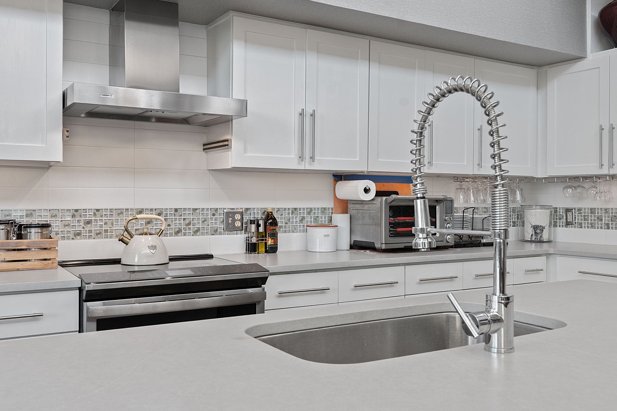 1600 Barton Springs Road, Unit 5406 Austin, TX 78704 - Photo 13 of 40 a kitchen with granite countertop a sink and cabinets