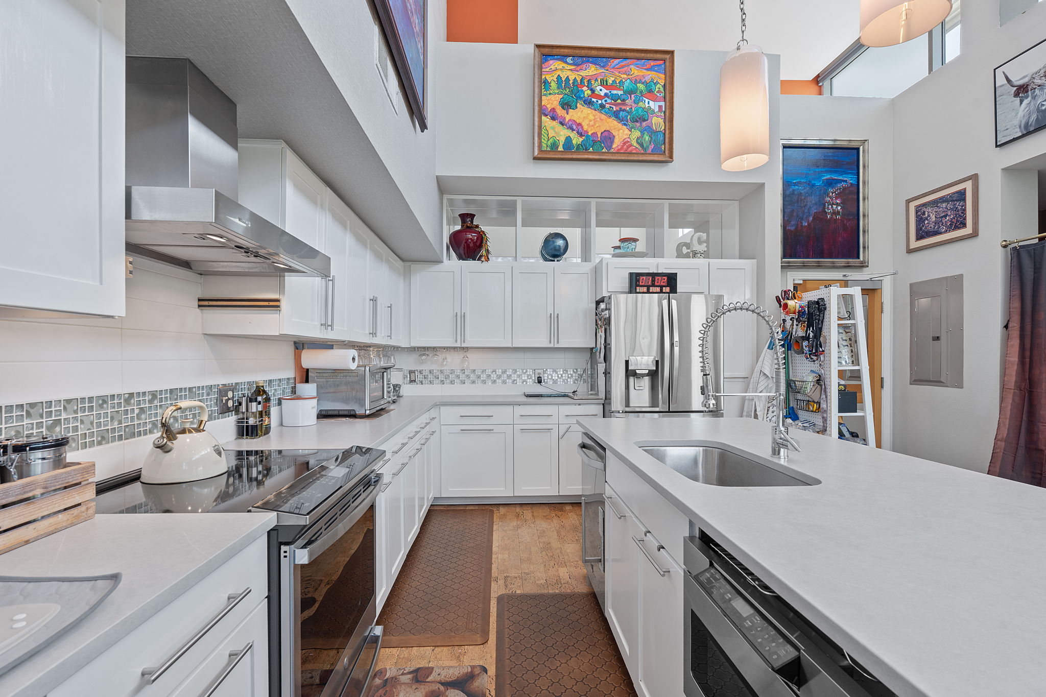 1600 Barton Springs Road, Unit 5406 Austin, TX 78704 - Photo 14 of 40 a kitchen that has a lot of cabinets in it